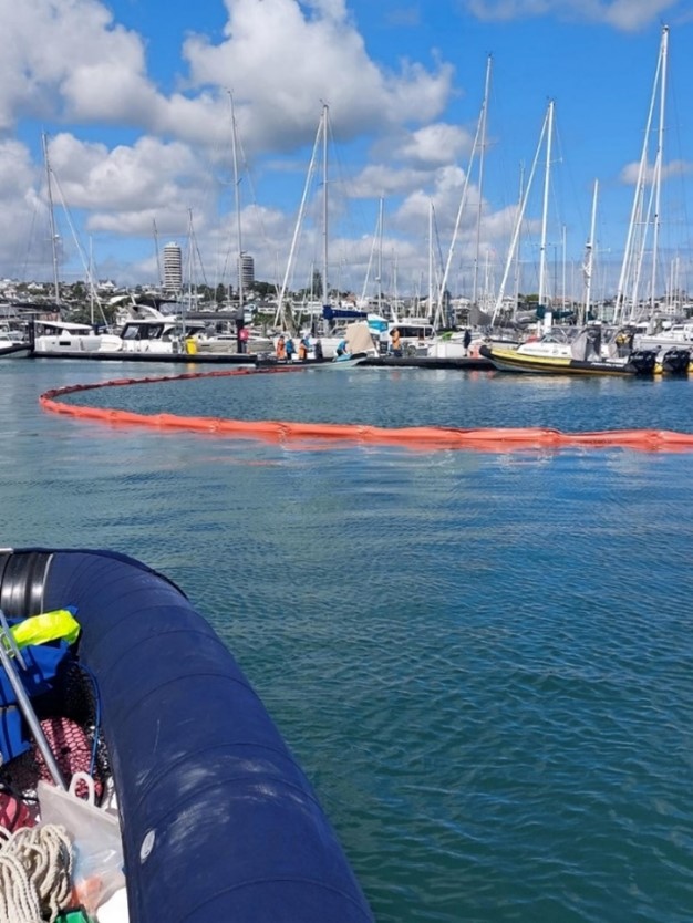 Boom deployment at fuel dock